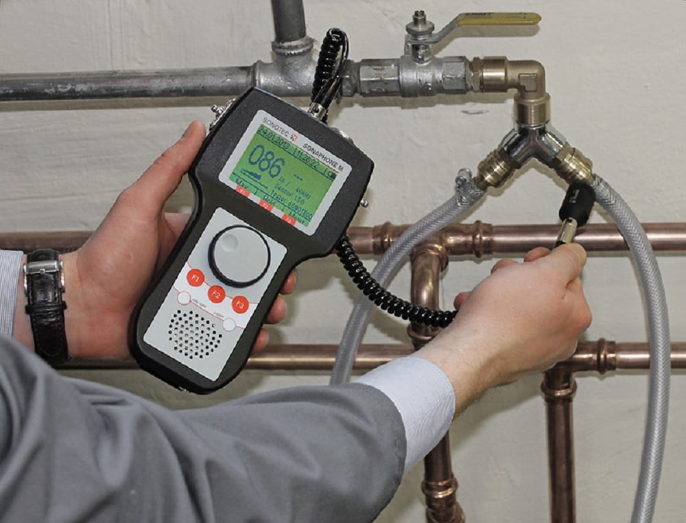 Plumber testing pipes with electronic leak detection equipment in Palm Beach Gardens